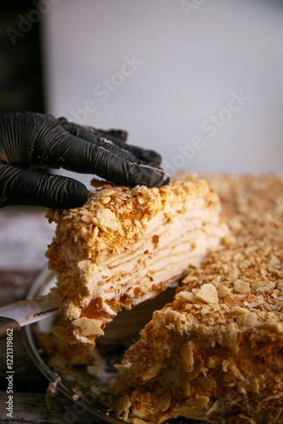 Fototapeta Layered cake with cream. piece of Napoleon cake. millefeuille cake. top view