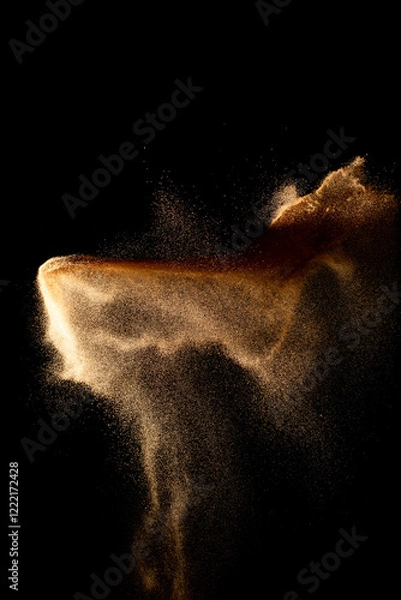 Obraz Sand flying explosion isolated on black background ,throwing freeze stop motion object design.