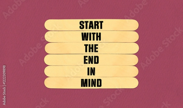 Fototapeta Start in End of Mind Symbol. Concept word Start With The End in Mind on beautiful wooden stick. Beautiful Pink Chart Paper Background. Business and Start in End of Mind concept. Copy space