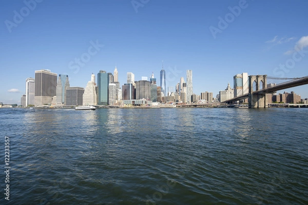 Fototapeta Downtown Manhattan skyline view from Brooklyn of the Brooklyn Bridge with East River in New York City