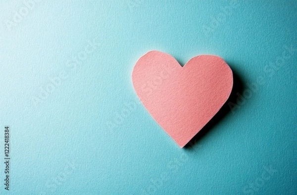 Fototapeta Valentine's Day background with pink paper hearts on a pastel-colored surface