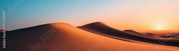Fototapeta A wide and ethereal desert scene drenched in the mellow light of morning or sunset.