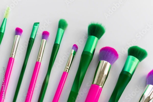 Obraz Spring must have beauty purchase concept. Green and pink makeup brushes over white background 