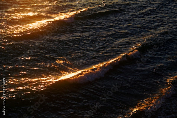 Obraz Photos of sea waves moving at sunset