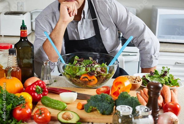 Obraz Chef man cooking in the kitchen.