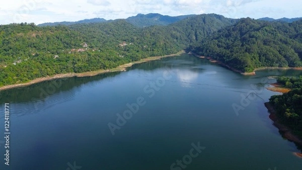 Fototapeta Aerial drone view of Sempor reservoir, Kebumen, Indonesia with a background of hills and trees