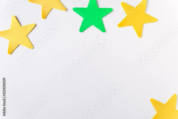 Fototapeta Flat lay of crafts color stars on the  white background with copy space. Kids art mockup