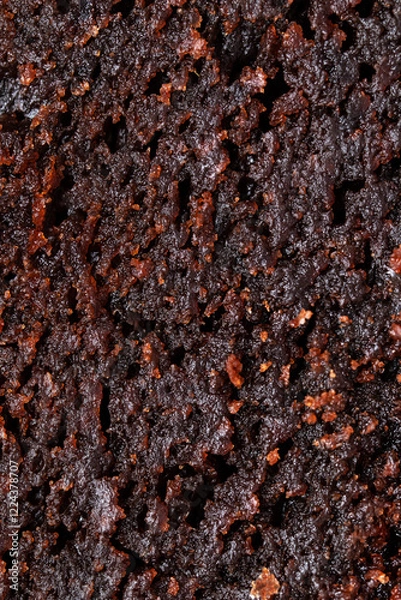Fototapeta Macro texture of brownie pie. Sticky and moist chocolate sponge cake close up. Fudge cake