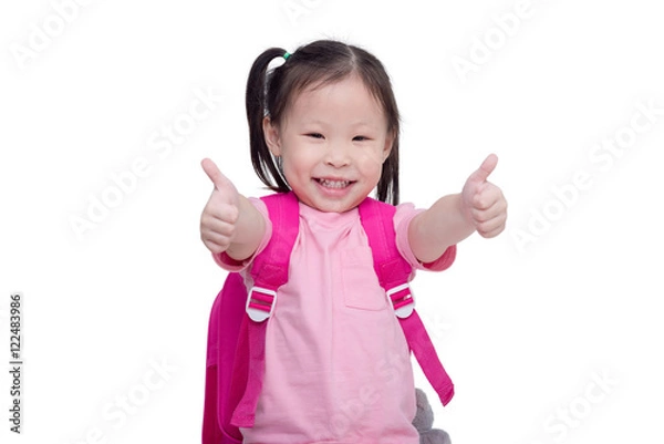 Obraz Little asian girl with backpack showing thumbs up and smiles