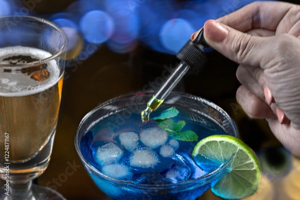 Fototapeta Concept of pouring GHB into a glass with a pipette