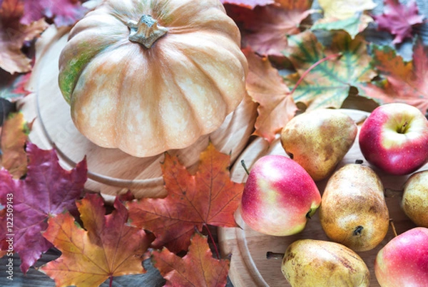 Fototapeta Pumpkin with apples on the wooden background