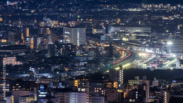 Fototapeta Lights from train and Kyoto Station in dense city at night