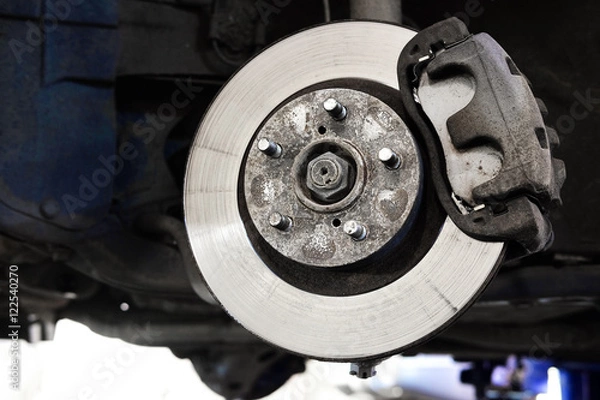 Fototapeta The image of a calliper disk brake close up