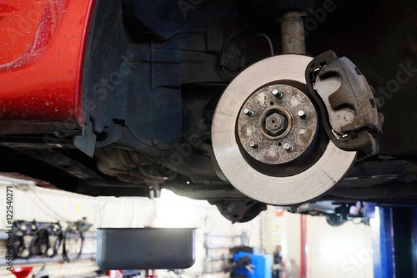 Fototapeta The image of a calliper disk brake close up