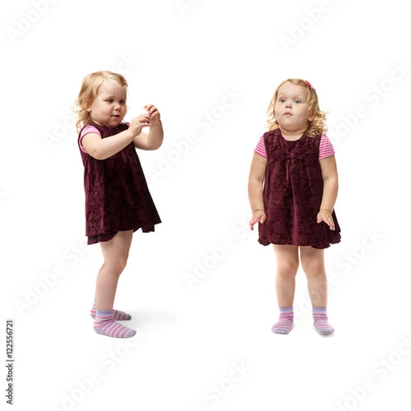 Fototapeta Young little girl standing over isolated white background