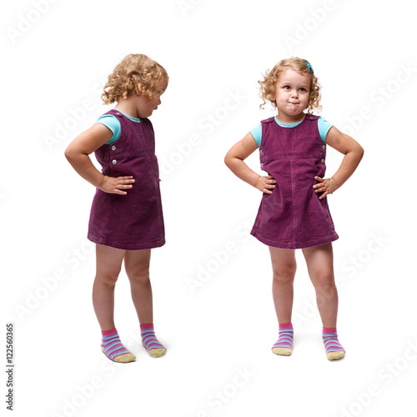 Fototapeta Young little girl standing over isolated white background