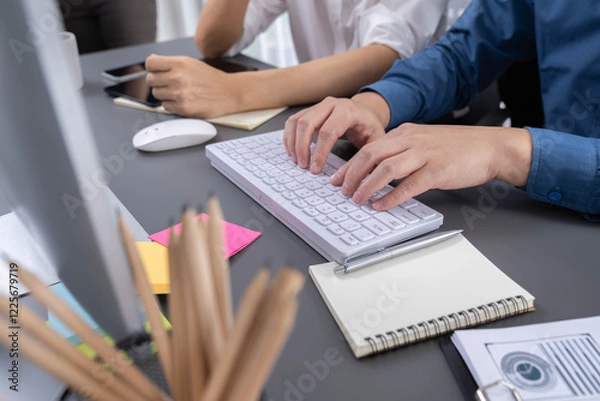 Fototapeta Group of diverse office worker employee working together on strategic business marketing planning on office workspace desk. Productive teamwork in business workplace concept. Prudent