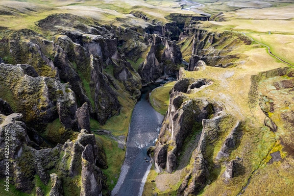 Obraz Breathtaking aerial drone view of a serene river winding through a majestic Fjadrargljufur Canyon in Iceland