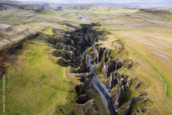 Obraz Breathtaking aerial drone view of a serene river winding through a majestic Fjadrargljufur Canyon in Iceland