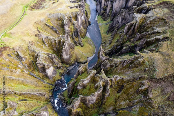 Obraz Breathtaking aerial drone view of a serene river winding through a majestic Fjadrargljufur Canyon in Iceland