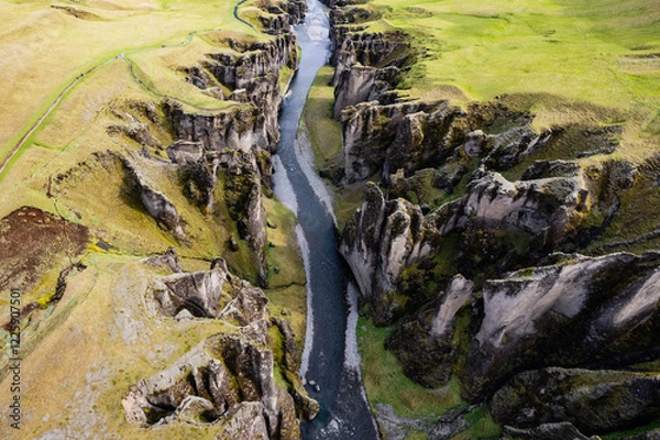 Obraz Breathtaking aerial drone view of a serene river winding through a majestic Fjadrargljufur Canyon in Iceland