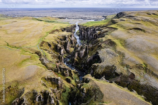 Obraz Breathtaking aerial drone view of a serene river winding through a majestic Fjadrargljufur Canyon in Iceland