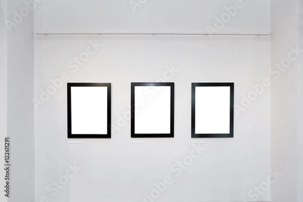 Obraz exhibition gallery interior with empty frames on wall