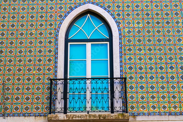 Obraz Typical colorful traditional architecture facade featuring Portuguese tiles azulejos in the old Alfama district of Lisbon