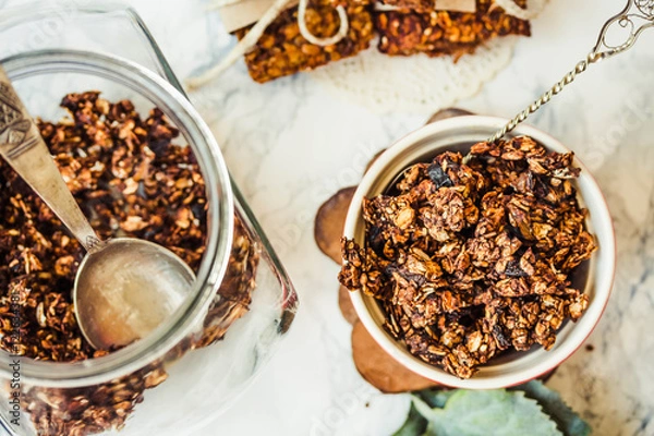 Fototapeta Chocolate homemade granola with peanut butter and pear,close up