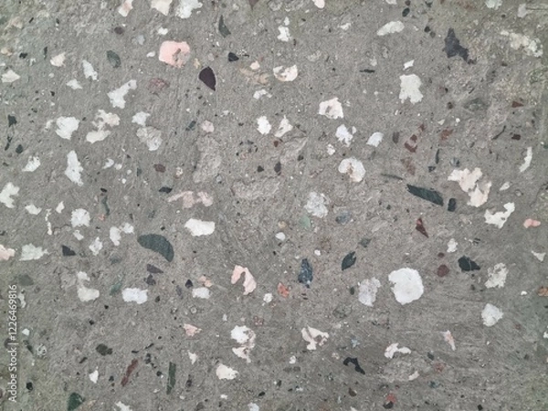Fototapeta Concrete surface with stones. Polished concrete with small stones
