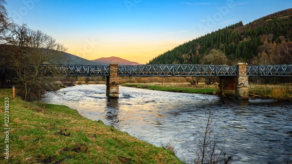 Fototapeta Tweed Bridge over River Tweed at Innerleithen.  The River Tweed is 97 miles long from source to estuary and runs eastward in the Scottish Borders