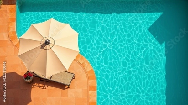 Fototapeta Top view of beach umbrella and sun lounger near turquoise water of swimming pool.