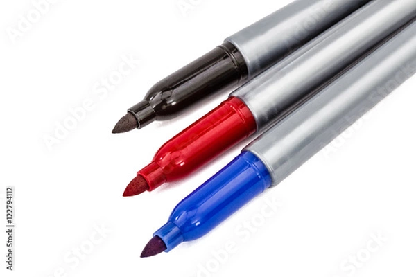 Fototapeta Three felt-tip pens markers highlighters close-up, isolated on w