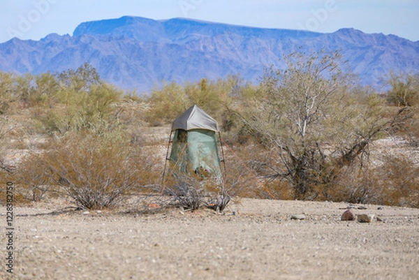 Obraz Tent shower and toilet enclosure sitting alone in the desert