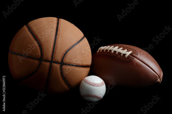 Obraz piłka nożna, koszykówka, baseball na czarnym tle