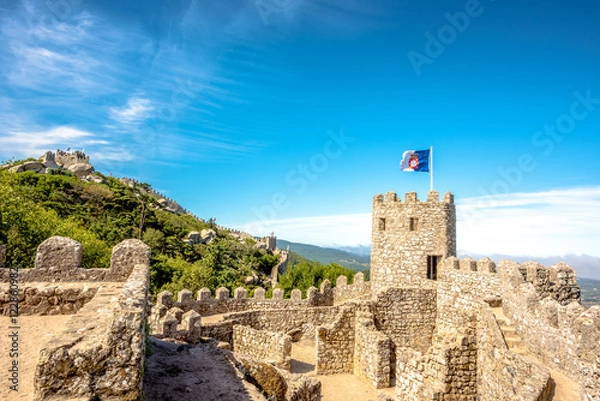 Obraz A fragment of the walls of a fortress with battle tower