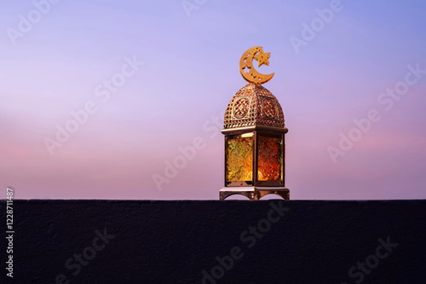 Fototapeta Golden lantern that have moon symbol on top with dusk sky background