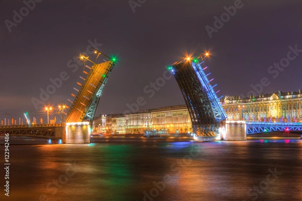 Fototapeta Night view of illuminated Neva River, open Palace Bridge and Palace Embankment, Saint Petersburg, Russia.
