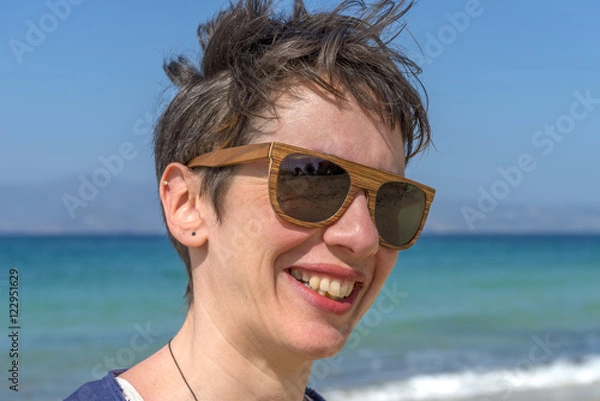 Fototapeta Young woman on one of the most beautiful beaches in the world in