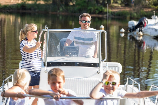 Obraz family enjoying a summer day on a boat