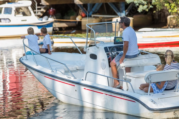 Obraz family hanging out together in a boat