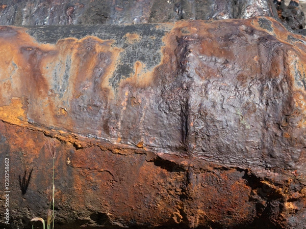 Fototapeta Close-up of an old rusty cannon, corroded rust texture, damaged, effect of sea spray on iron