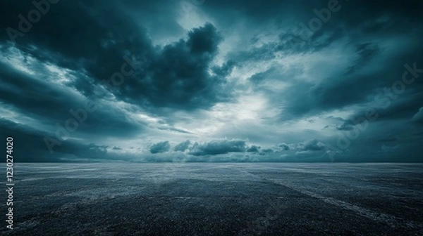 Fototapeta A dramatic nighttime horizon with a dark concrete floor, framed by an expansive sky filled with striking clouds, evoking a cinematic atmosphere