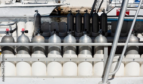 Obraz Many Scuba tanks lines up on a commercial dive boat in Key Largo, Florida, USA. 