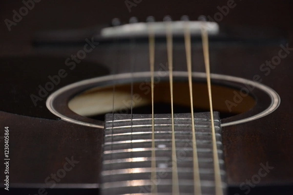 Fototapeta Black guitar with strings from close up