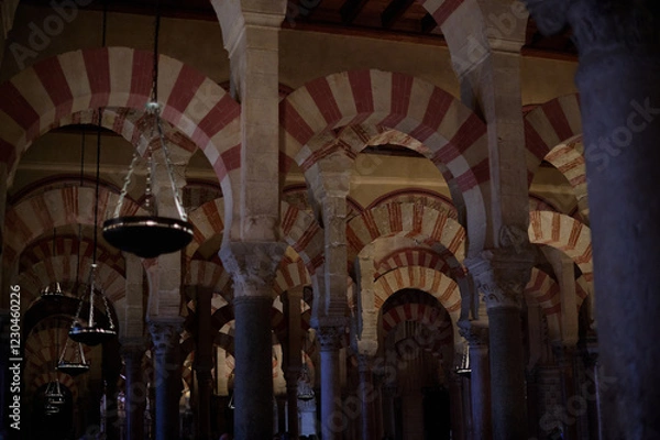 Fototapeta The interior of the Mosque-Cathedral of Córdoba, featuring its iconic columns and horseshoe arches, a masterpiece of Moorish and Spanish architecture in Andalusia, Spain
