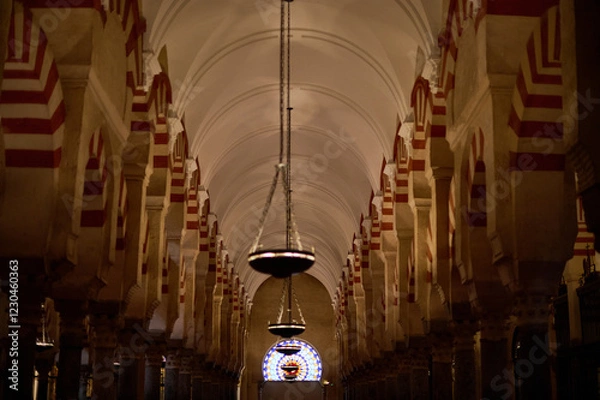 Obraz The interior of the Mosque-Cathedral of Córdoba, featuring its iconic columns and horseshoe arches, a masterpiece of Moorish and Spanish architecture in Andalusia, Spain