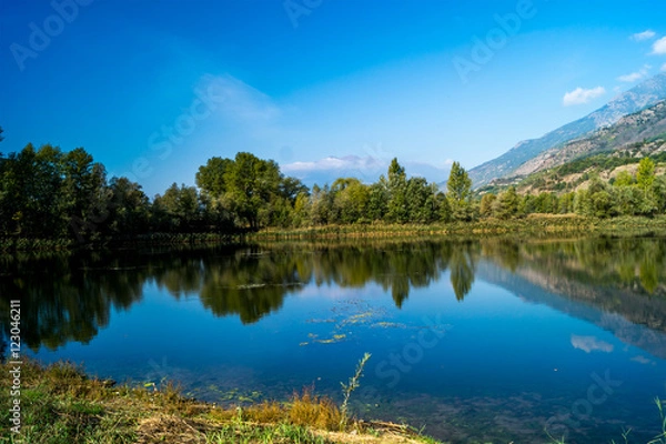 Obraz mountains, sky and clouds reflected in the lake