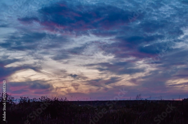 Fototapeta sunset over the clouds