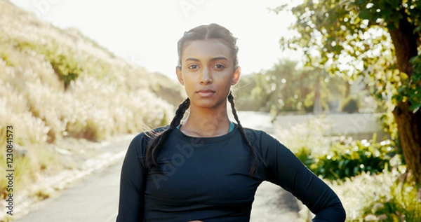 Fototapeta Portrait, outdoor and woman with fitness, wellness and training with challenge, pride and endurance. Face, healthy person and runner in street, practice and workout with nature, serious and progress